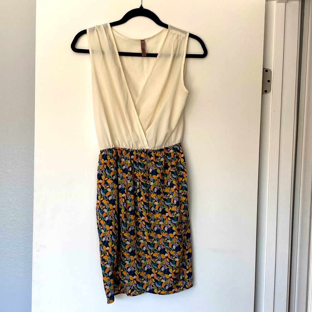 Peppermint summer dress. Cream top, purple bottom with leaf pattern.